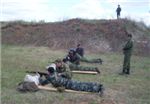 Военный комиссар подполковник Музафаров Б.Б. командует стрельбой из боевого автомата Калашникова.